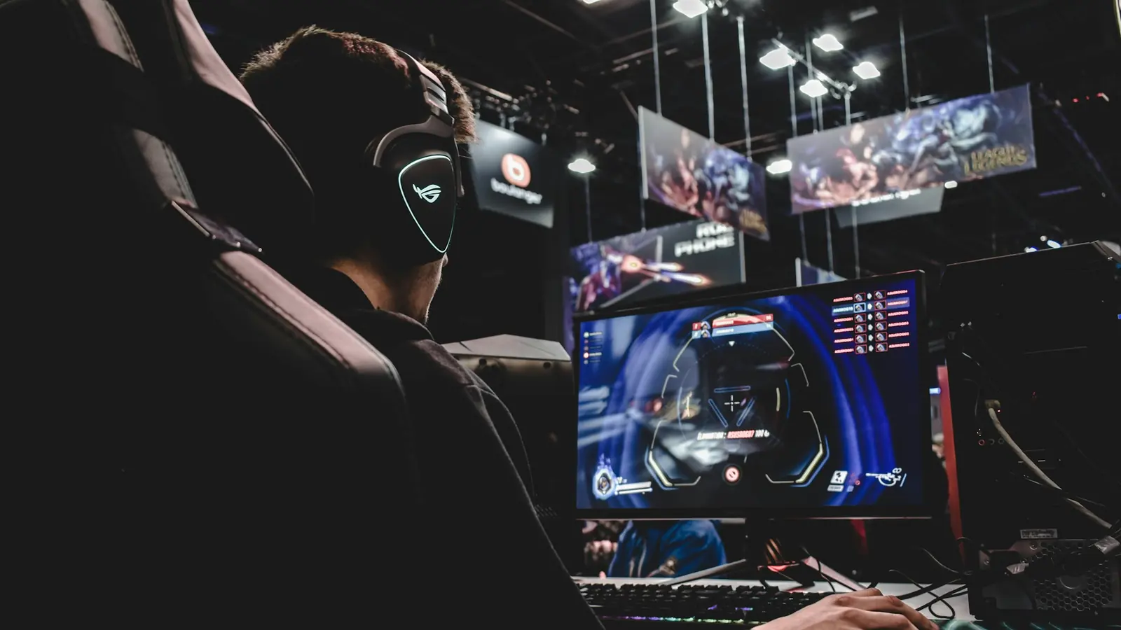 Gamer sitting in a gaming chair playing on a PC